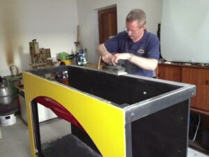 Pat works on the refurbishment of the marionette stage.